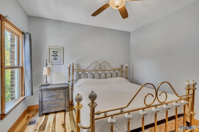 bedroom featuring light hardwood / wood-style flooring and ceiling fan