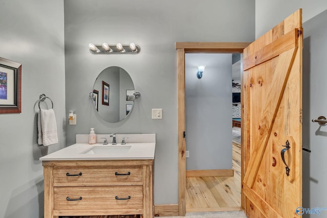 bathroom featuring vanity and hardwood / wood-style floors