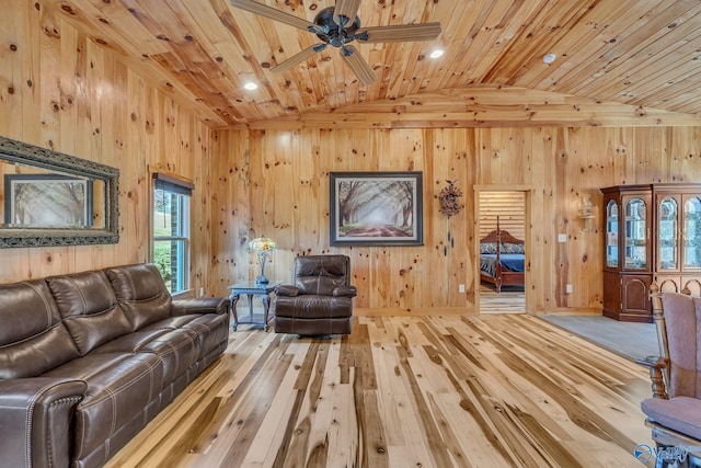 living room featuring ceiling fan, wood-type flooring, lofted ceiling, and wooden ceiling