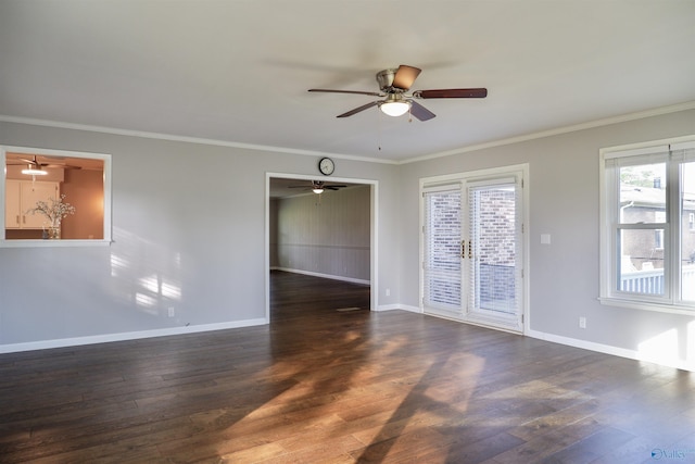 empty room featuring a ceiling fan, ornamental molding, french doors, and wood finished floors