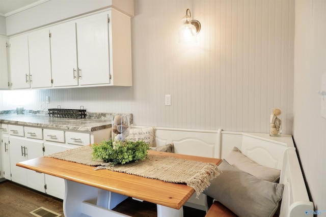 kitchen featuring visible vents, light countertops, white cabinetry, and dark wood-style flooring
