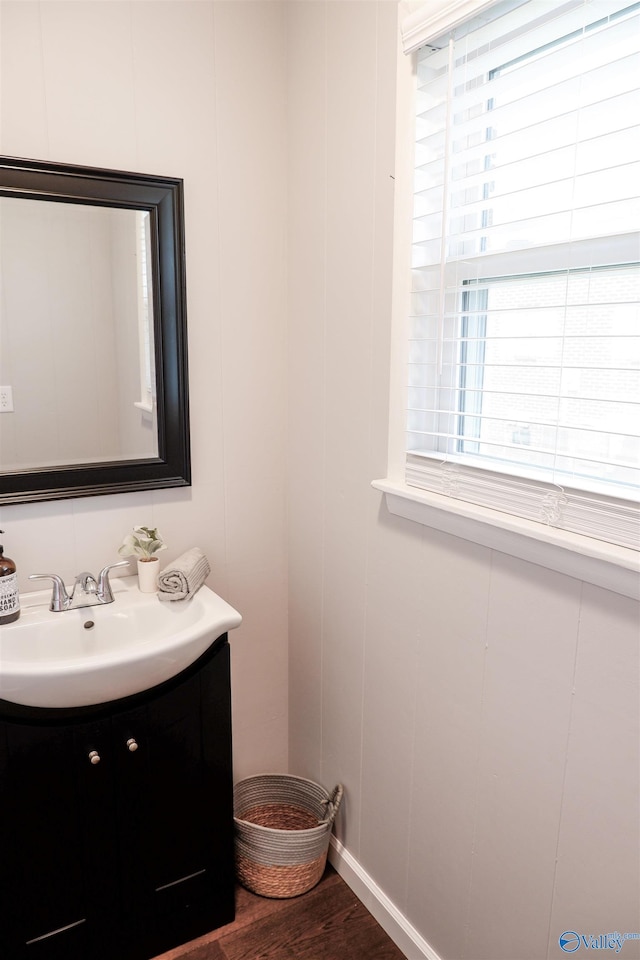 bathroom featuring vanity and wood finished floors