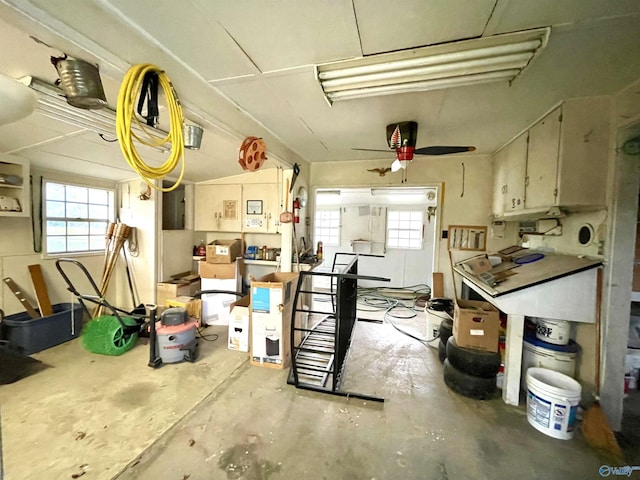 garage with electric panel and ceiling fan