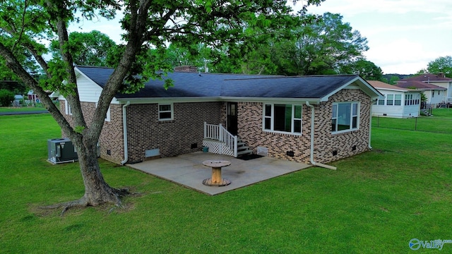 rear view of house with brick siding, crawl space, central AC unit, and a patio area