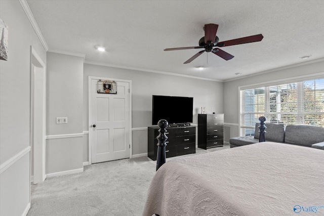 bedroom with ornamental molding, a ceiling fan, light carpet, and baseboards