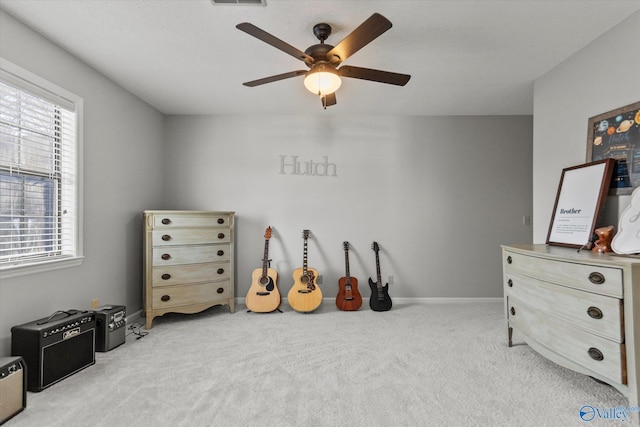 rec room featuring baseboards, carpet floors, ceiling fan, and plenty of natural light