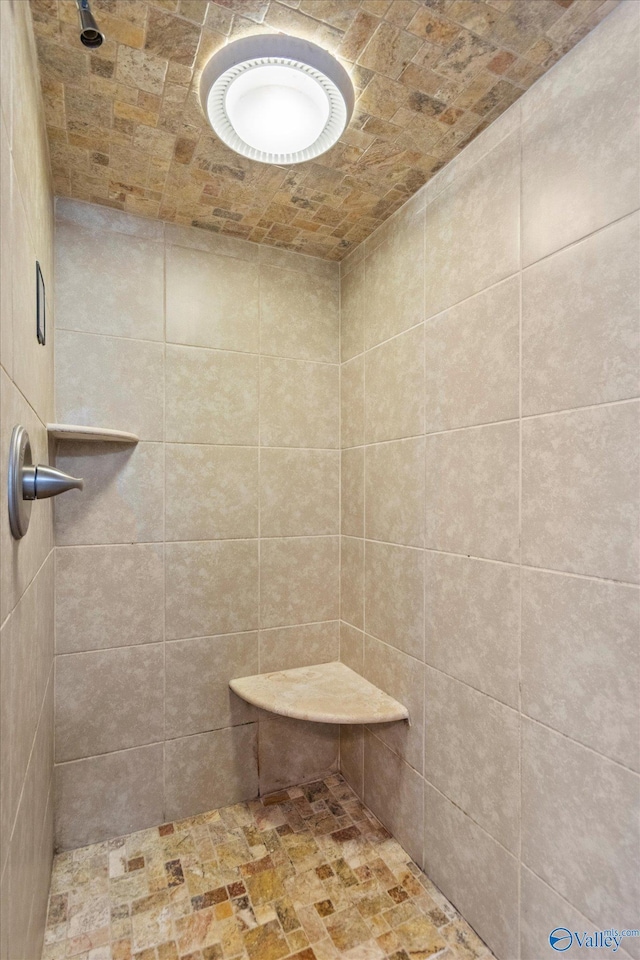 bathroom with tiled shower