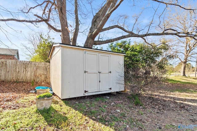 view of shed with fence