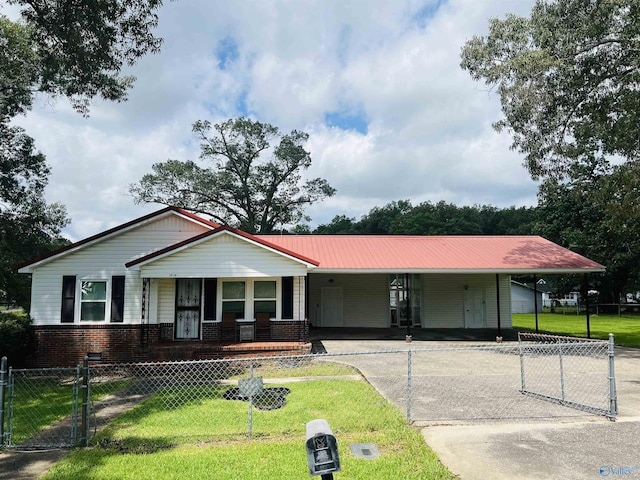 1315 Colbert Ave, Gadsden, AL 35904 - view of front of property with an attached carport, a porch, driveway, and a fenced front yard