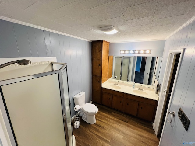 1315 Colbert Ave, Gadsden, AL 35904 - bathroom with wood finished floors, double vanity, ornamental molding, and a shower stall