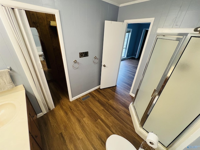 1315 Colbert Ave, Gadsden, AL 35904 - bathroom featuring a shower stall, crown molding, vanity, and wood finished floors