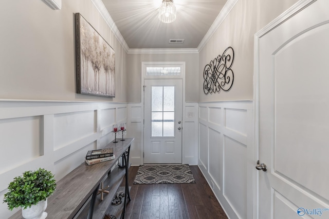 doorway to outside featuring dark hardwood / wood-style floors and crown molding