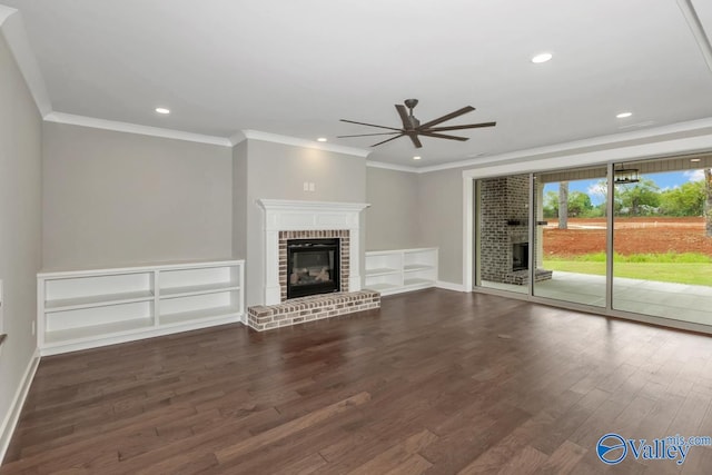 unfurnished living room featuring ceiling fan, a fireplace, dark hardwood / wood-style floors, and ornamental molding