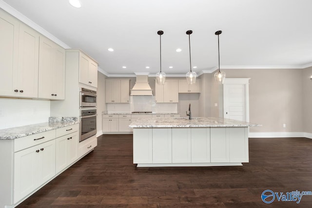 kitchen featuring premium range hood, ornamental molding, tasteful backsplash, appliances with stainless steel finishes, and baseboards