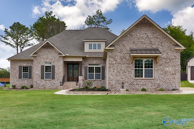 view of front of home featuring a front yard and a garage