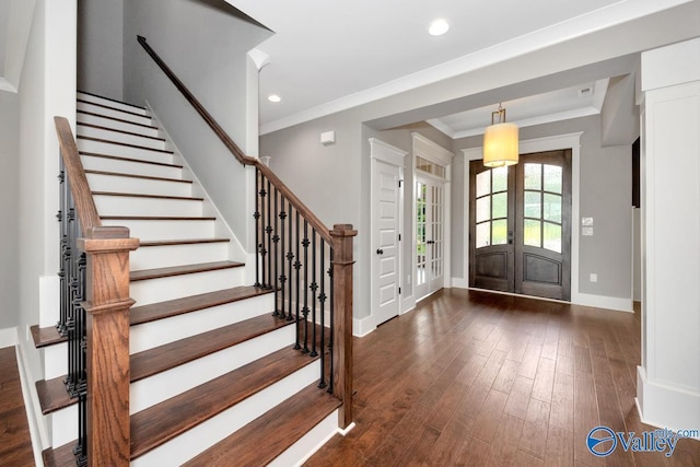 entryway featuring ornamental molding, dark wood-style floors, recessed lighting, french doors, and baseboards