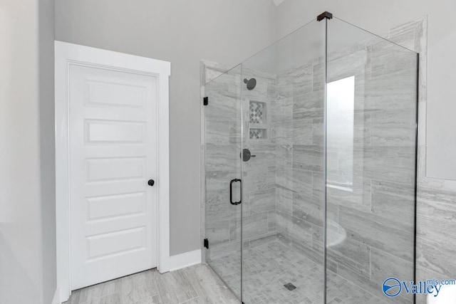 bathroom with an enclosed shower