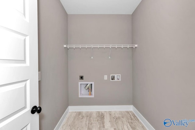 laundry area with hookup for an electric dryer, hookup for a washing machine, and light hardwood / wood-style flooring