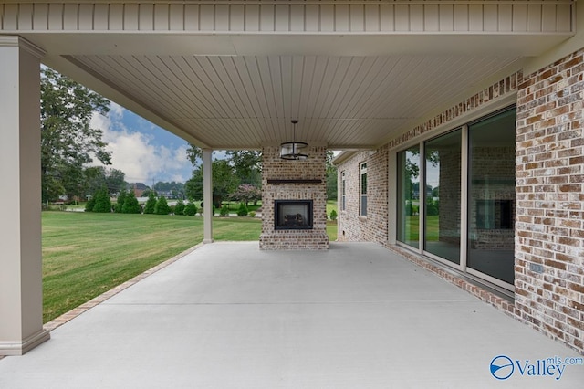 view of patio featuring an outdoor brick fireplace