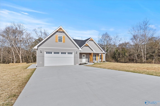 craftsman-style house with a garage and a front lawn