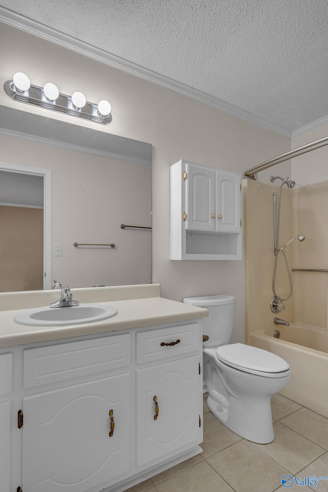 full bathroom with tile patterned flooring, vanity, ornamental molding, a textured ceiling, and washtub / shower combination