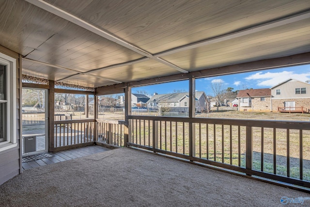 unfurnished sunroom featuring wood ceiling