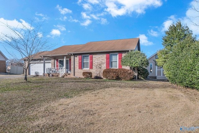 view of front of house with a garage and a front yard