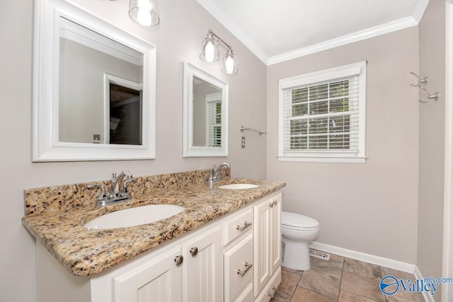 full bath with crown molding, baseboards, toilet, and a sink