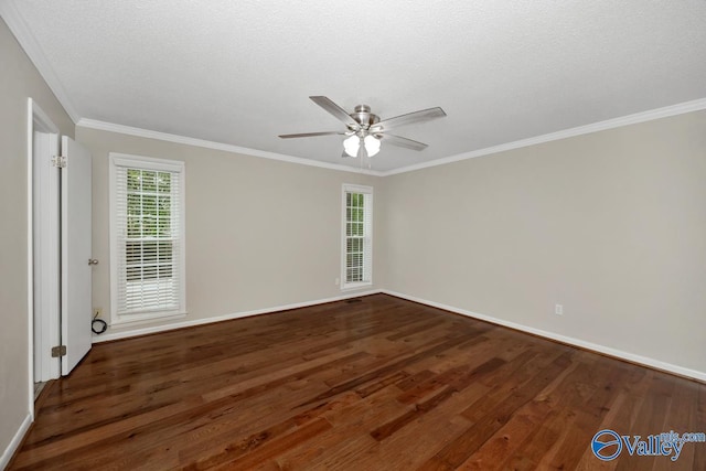 spare room with ceiling fan, baseboards, and wood finished floors