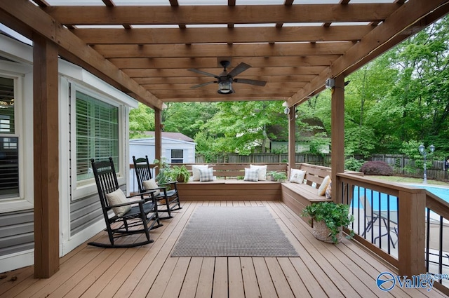 wooden terrace featuring a fenced backyard, a pergola, and a ceiling fan