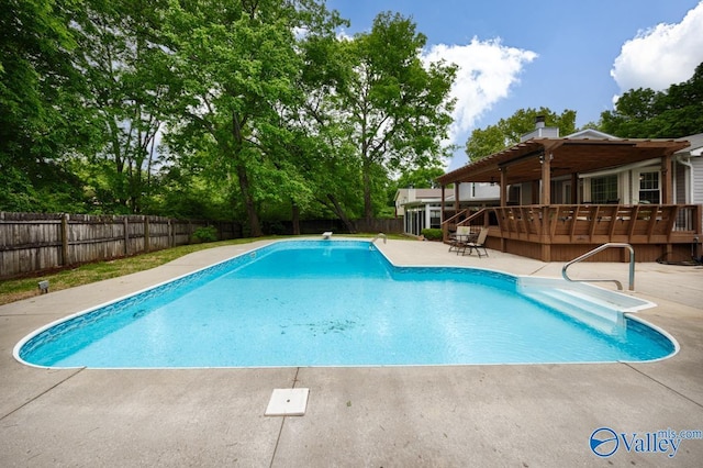 view of pool with a fenced in pool, a patio, a fenced backyard, and a deck