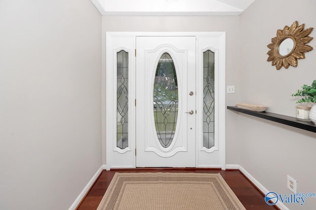 foyer entrance with baseboards and dark wood-style floors