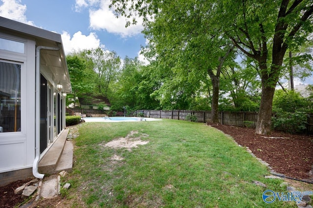 view of yard featuring a fenced backyard and a fenced in pool