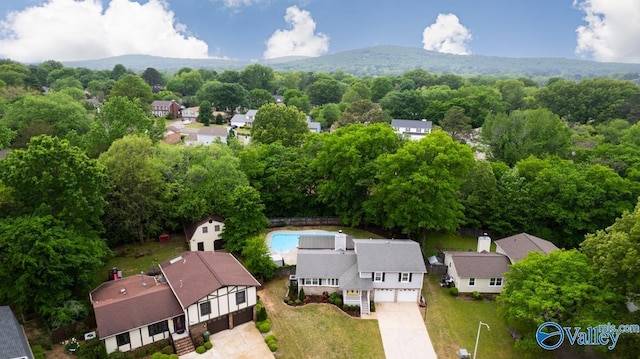 birds eye view of property featuring a mountain view