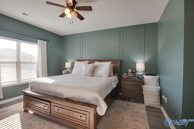 bedroom with hardwood / wood-style flooring and ceiling fan
