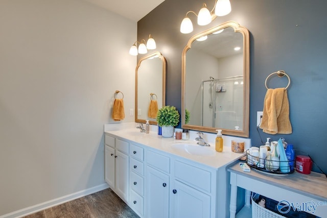 bathroom featuring vanity, hardwood / wood-style flooring, and a shower with door