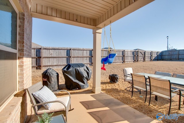 view of patio featuring a grill