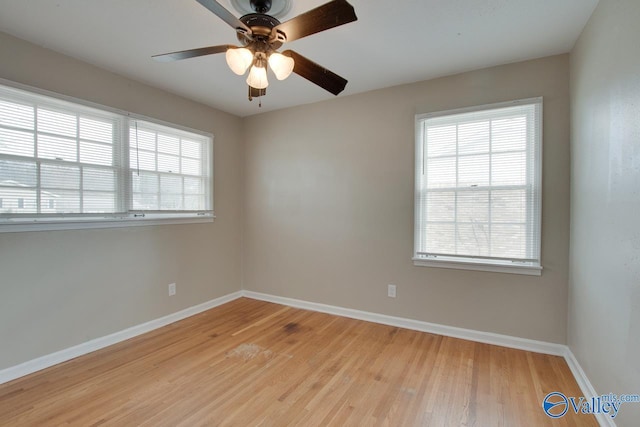 unfurnished room with plenty of natural light, ceiling fan, and light hardwood / wood-style flooring