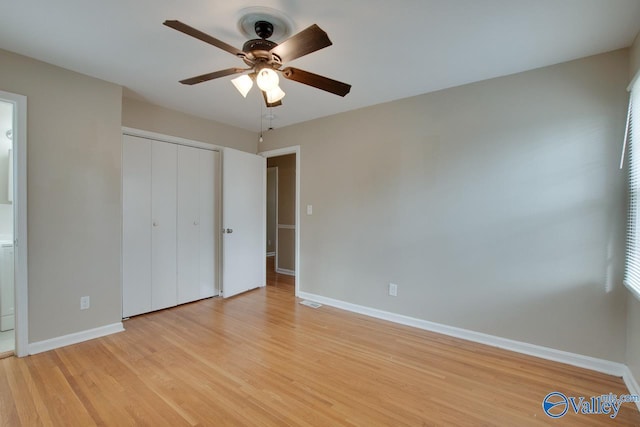 unfurnished bedroom featuring light wood-type flooring, a closet, and ceiling fan