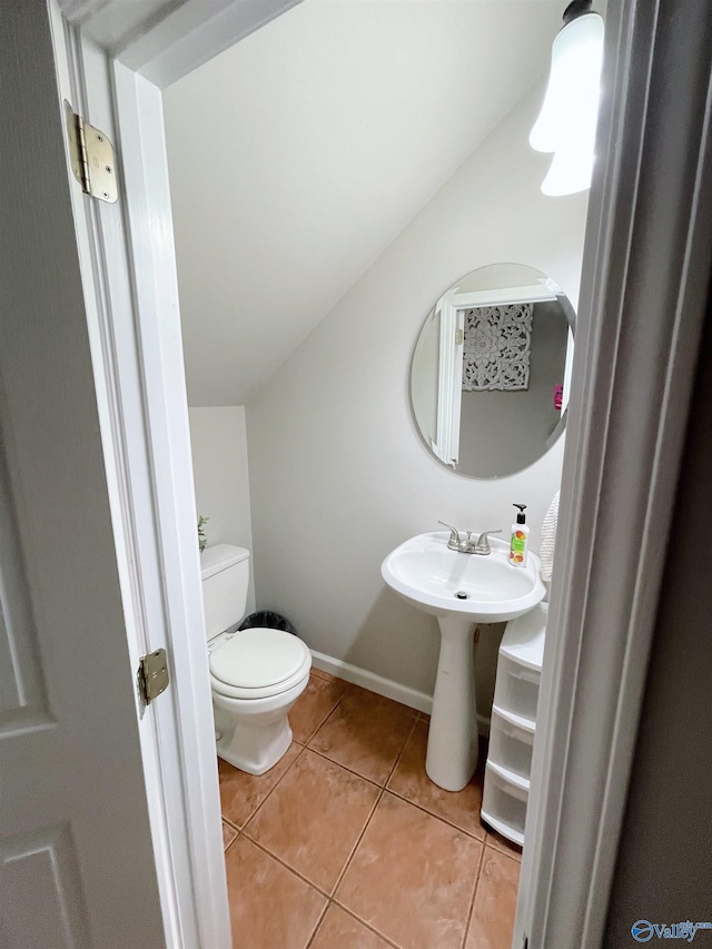 bathroom with tile patterned flooring and toilet