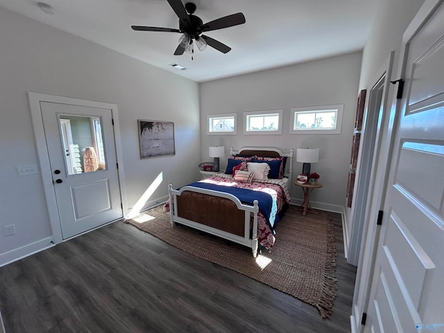 bedroom with ceiling fan and dark hardwood / wood-style flooring