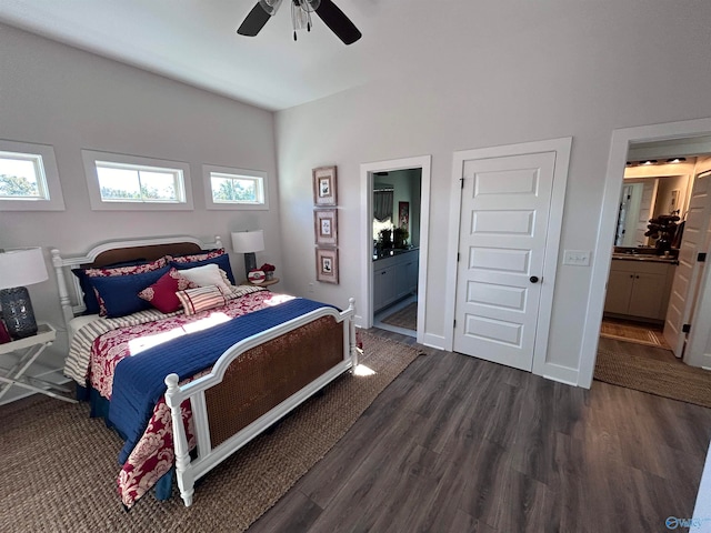 bedroom with ceiling fan, ensuite bathroom, and dark hardwood / wood-style flooring