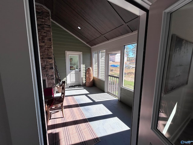 sunroom / solarium with lofted ceiling and wood ceiling