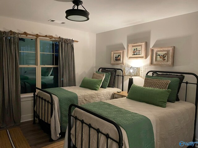 bedroom featuring wood-type flooring