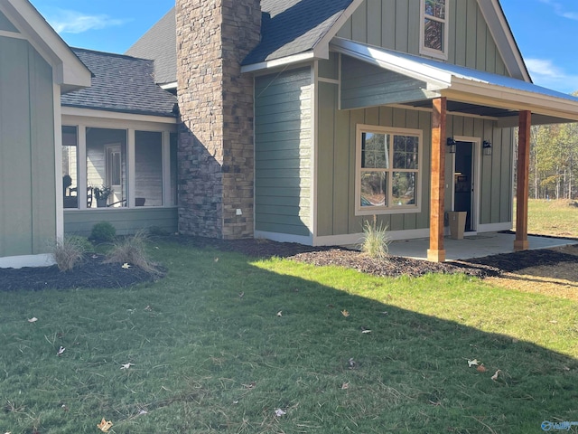 view of side of property featuring a yard