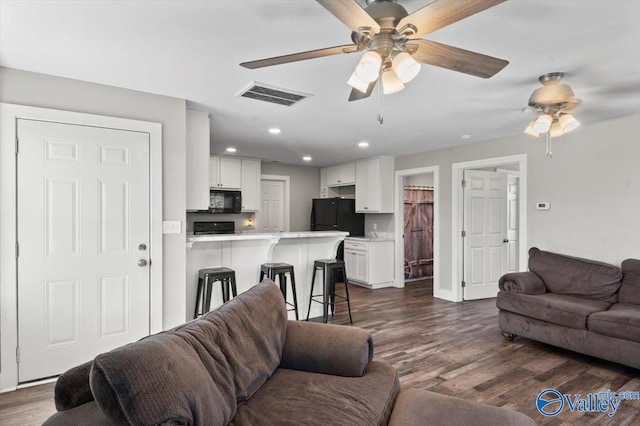 2403 Hog Jaw Rd, Arab, AL 35016 - living room featuring a ceiling fan, recessed lighting, visible vents, and dark wood-style flooring