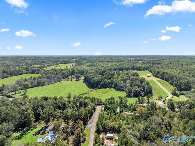 bird's eye view featuring a wooded view