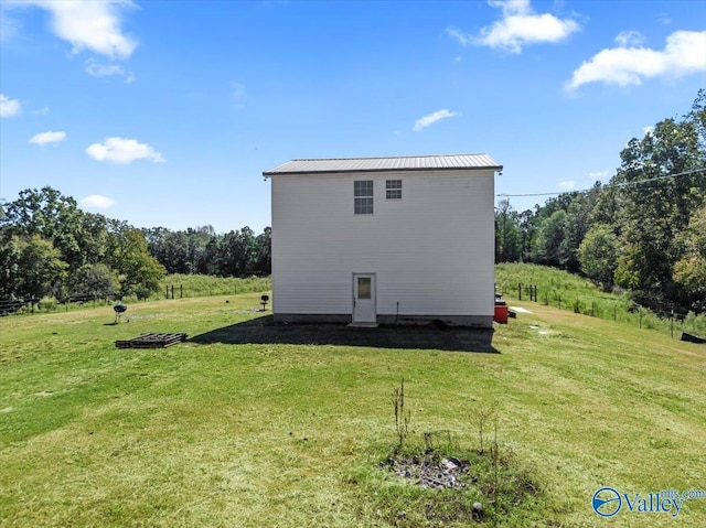 2403 Hog Jaw Rd, Arab, AL 35016 - back of house with a lawn and metal roof