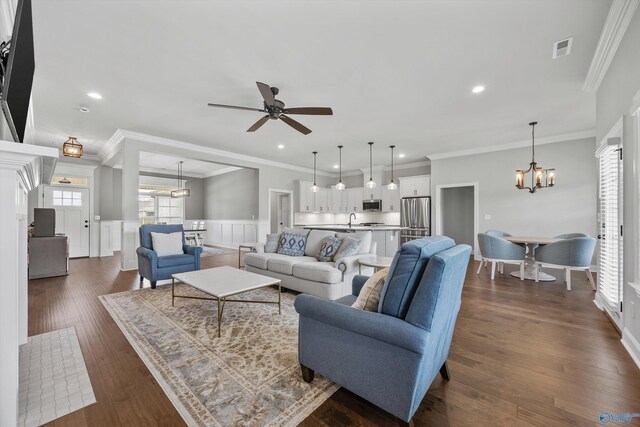 106 Timber Springs Ct, Madison, AL 35756 - living room with a chandelier, healthy amount of natural light, ceiling fan, a wainscoted wall, and recessed lighting