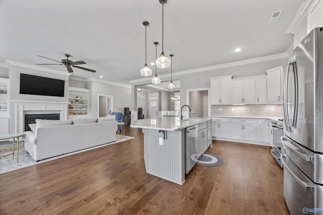 106 Timber Springs Ct, Madison, AL 35756 - kitchen featuring stainless steel appliances, a ceiling fan, ornamental molding, open floor plan, and white cabinets
